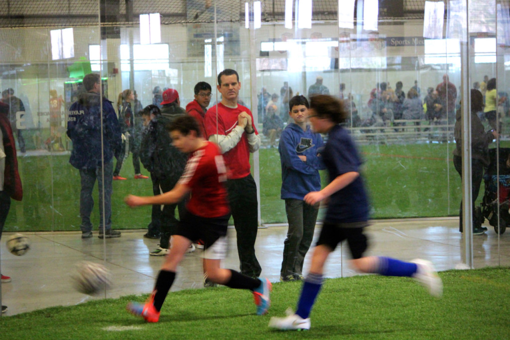 Trip Fitch and his son, Rex, watch the Blue Crush play at the Virginia Field House. [John-Henry Doucette/The Princess Anne Independent News]