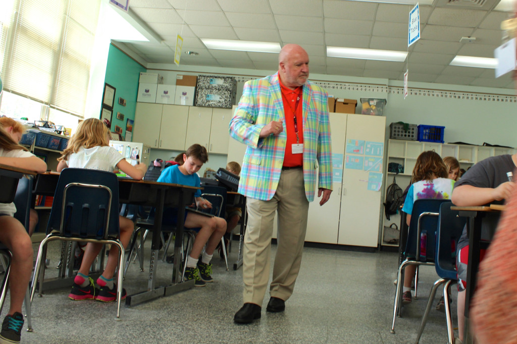 he is principal. Below right, Davenport speaks with Lilly West, a former Creeds Elementary student who now teaches at the school. [John-Henry Doucette/The Princess Anne Independent News]