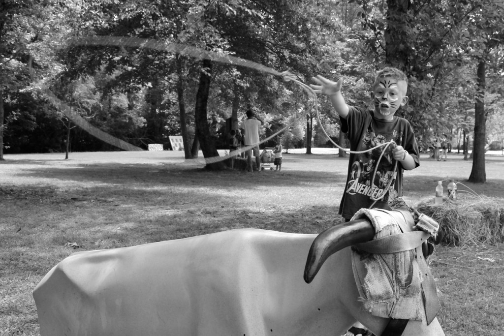 Hunter Bates, 6, of Green Run lets a lasso fly while sporting tiger face paint. [John-Henry Doucette/The Princess Anne Independent News]