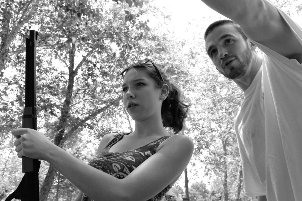 Isabel Little, a 15-year-old rising sophomore at Salem High School, compares notes with Tyler McIntosh, 23, of Pungo after shooting at a target with a BB rifle. [John-Henry Doucette/The Princess Anne Independent News]