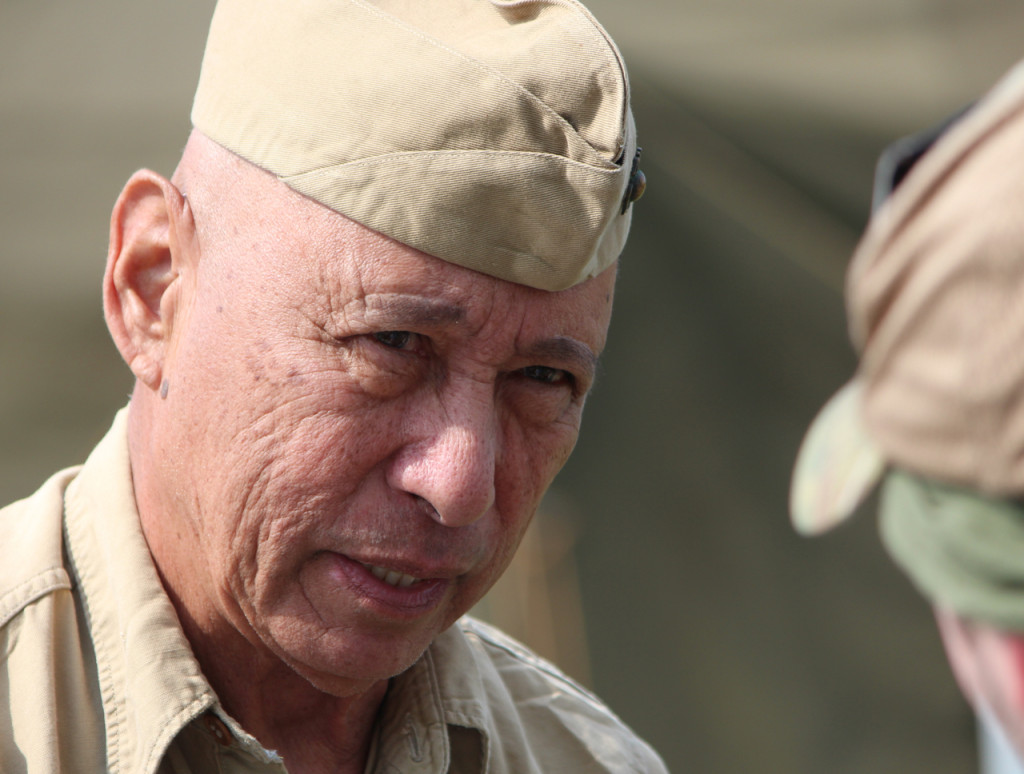 Dave Robles, 76, of Beaufort, S.C., wears a World Warr II-era uniform while reenacting as a forward control member with Marine Fighting Squadron 115, a Corsair squadron that served in the Pacific. Robles served 31 years in the U.S. Marine Corps, and he has been involved in reenacting for about 12 years. This was his first time participating in the Warbirds Over the Beach air show. [John-Henry Doucette/The Princess Anne Independent News]