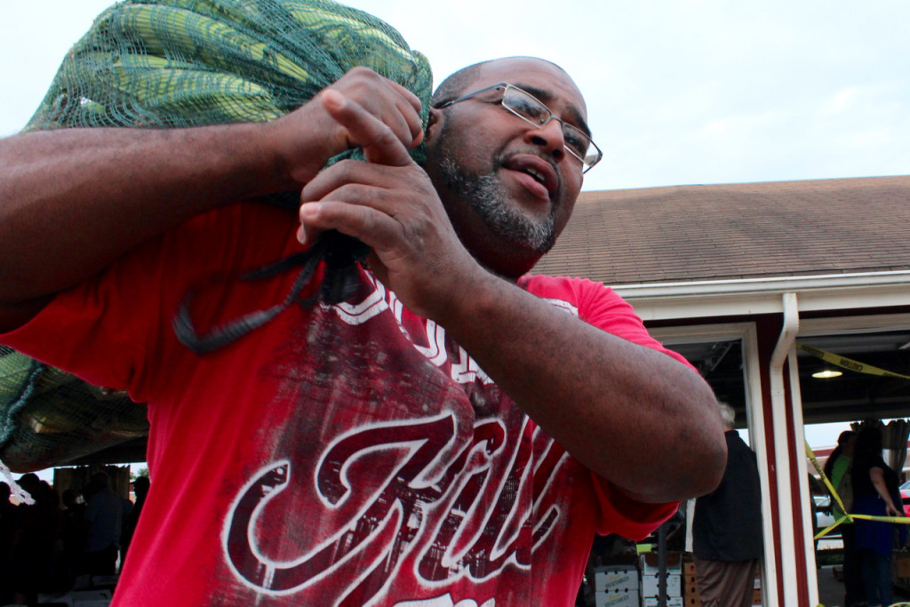 it during the weekly produce auction at the Virginia Beach Farmers Market. They came, in part, because they wanted to change their eating habits. “It’s better than the store,” Carrington said. [John-Henry Doucette/The Princess Anne Independent News]