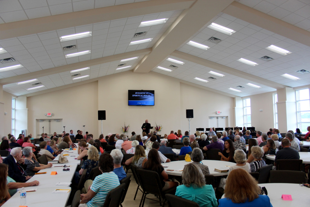 The Rev. Chuck Moseley, pastor of Oak Grove Baptist Church, delivers a sermon during a special service in the church’s new multipurpose building in July. [John-Henry Doucette/The Princess Anne Independent News]