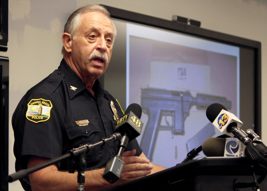 City police Chief Jim Cervera discusses an incident in which two people died after one of them opened fire upon police outside a convenience store at Salem and Lynnhaven Roads. The monitor behind him shows a weapon police said they recovered. [John-Henry Doucette/The Princess Anne Independent News]