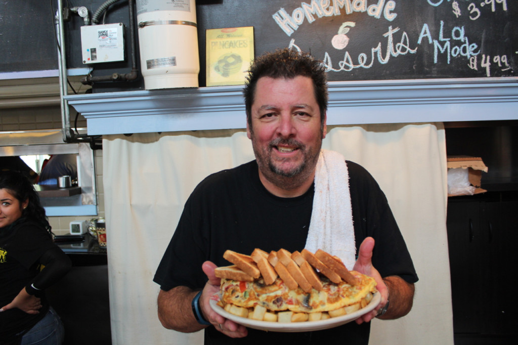  At right, Scot Wilson, owner of Princess Anne County Grill, holds Eggzilla. [John-Henry Doucette/The Princess Anne Independent News]