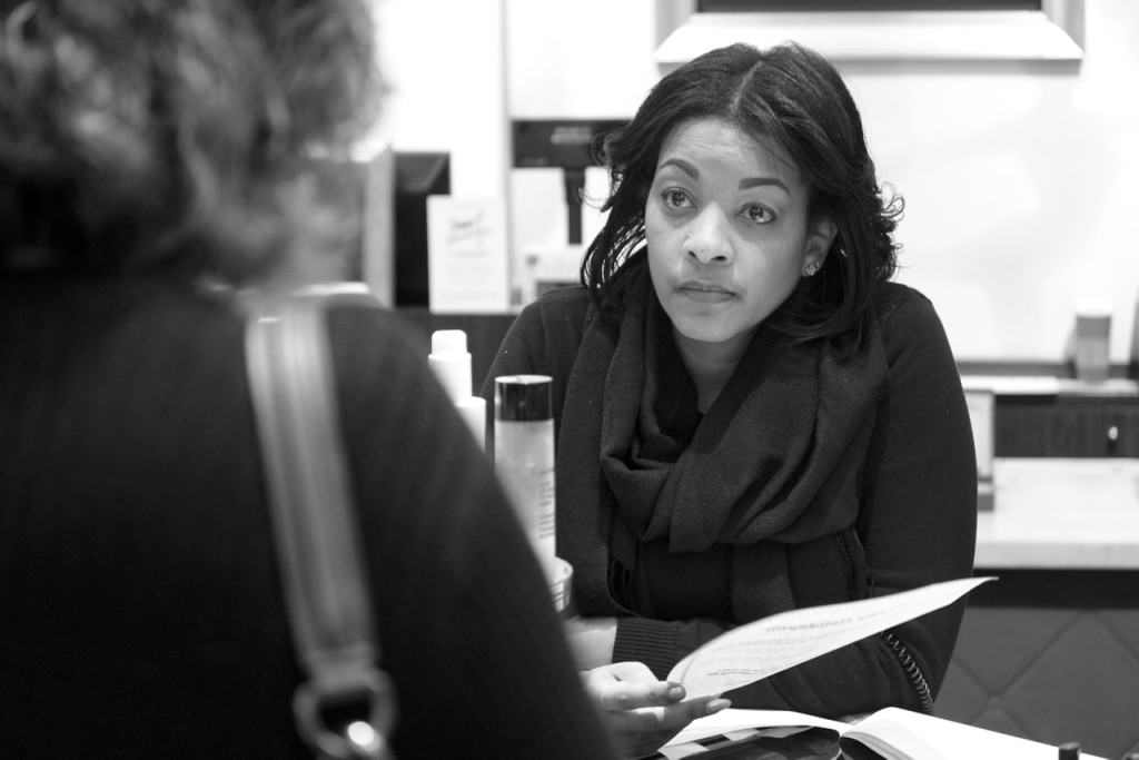 LaVonne Harston, a supervisor at the shop Bare Minerals, listens to the tips. She said she checks identification because “just because you have a card, it doesn’t mean it’s you.” [John-Henry Doucette/The Princess Anne Independent News]