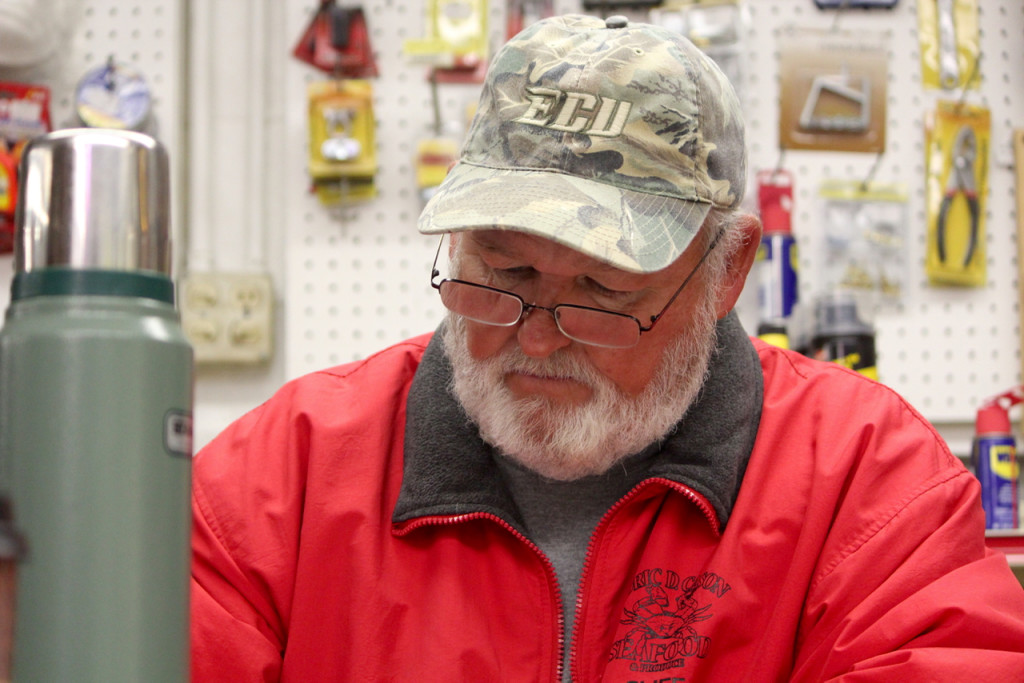 Cliff Scott, who has run the draw for years, is shown at work in Knotts Island Market. [John-Henry Doucette/The Princess Anne Independent News]