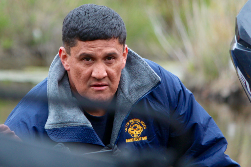 Alex Diaz of Bayside helps bring a zodiac boat out of the water. The rescue happened on Diaz’s first day with the Virginia Beach Volunteer Rescue Squad. [John-Henry Doucette/The Princess Anne Independent News]