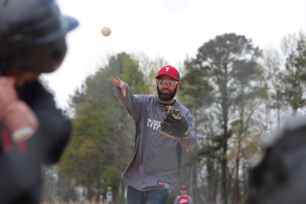 Derrick Howell, a coach of the Tidewater Titans, pitches during a game at the baseball field on his property in Blackwater in April. [John-Henry Doucette/The Princess Anne Independent News]