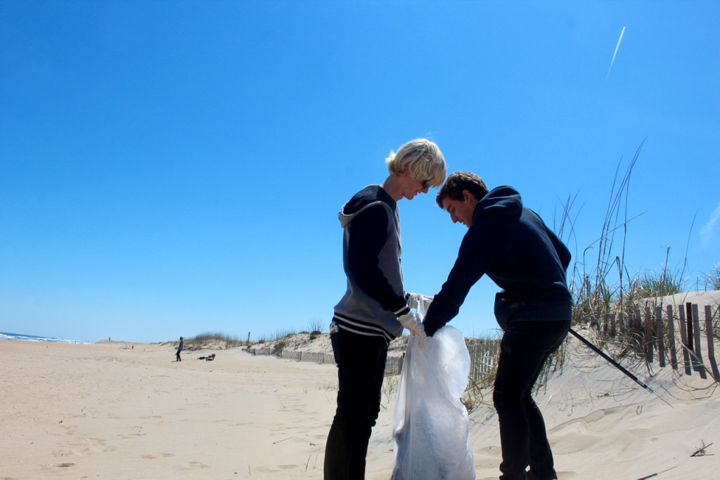 Dylan Ahern and Erik Cole of Ocean Lakes participate in the cleanup on the beach. The young men said they spend a lot of time at the beach in summertime. [John-Henry Doucette/The Princess Anne Independent News]