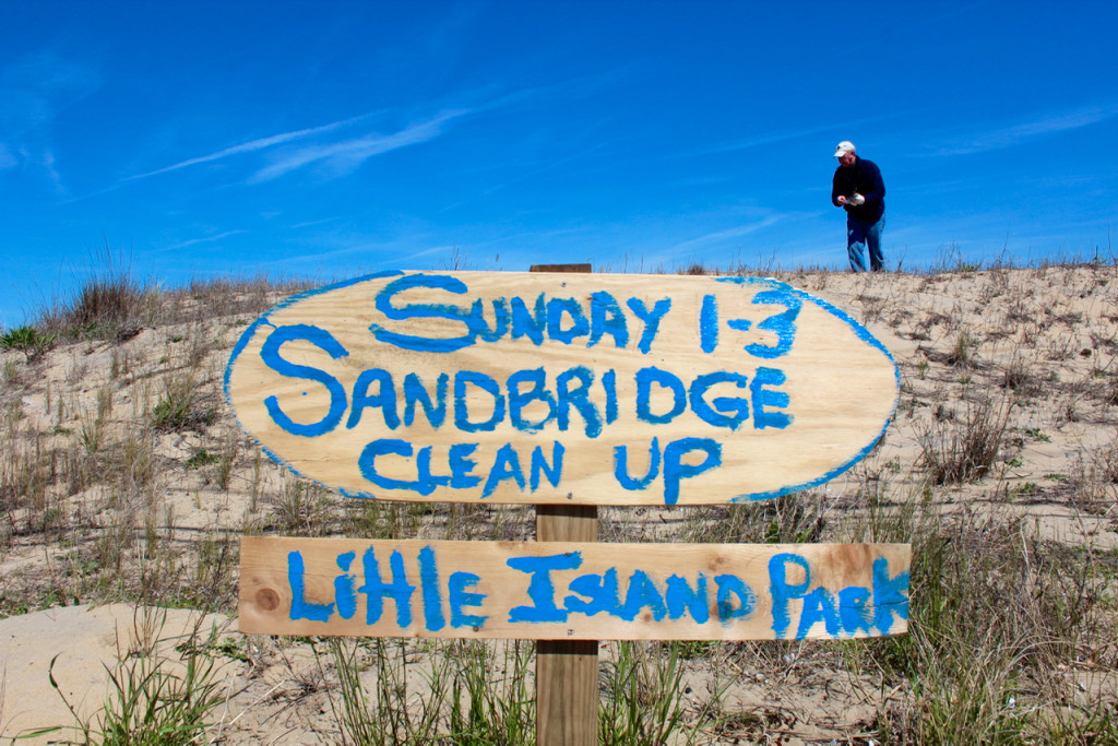 Sandbridge resident Wade Malaby hunts for garbage during the cleanup in Sandbridge on Sunday, April 9. [John-Henry Doucette/The Princess Anne Independent News