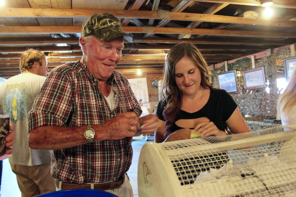 John Barnes, 82, of Knotts Island, N.C., and Ashley Craft, 26, of the Virginia Beach Oceanfronttook part in the raffle to benefit Ducks Unlimited during the Knotts Island chapter’s banquet at Blue Pete Haven. [John-Henry Doucette/The Princess Anne Independent News]