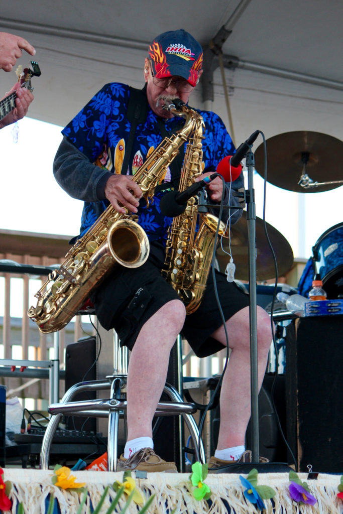 Chuck Williams of The Rhondels plays two saxes at once during the Party at the Pier. [John-Henry Doucette/The Princess Anne Independent News]