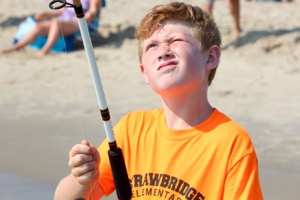 Colin Benson, 10, of the Castleton area, adjusts his line. Benson and his brother, Aidan Benson, 8, have participated in the clinic for two years. [John-Henry Doucette/The Princess Anne Independent News]
