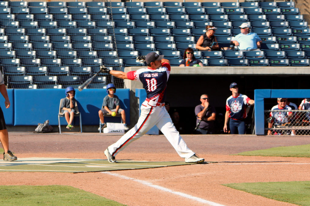 Master Firefighter Adam Hodge, at bat. Hodge is assigned to Station 11, Ladder 11, at the Oceanfront. [John-Henry Doucette/The Princess Anne Independent News]