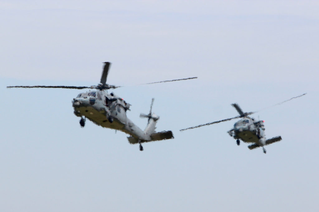 The Naval Air Station Oceana Air Show brought thousands of people to the base in Virginia Beach — including local fifth graders — to watch aircraft at work from Sept. 9-11, such as these two SH-60 Seahawks above. The helicopters appear distorted because they are seen photographed through jet wash from Blue Angels’ F/A-18 Hornets, unseen in the frame, that are on the flight line in the foreground during the practice air show on Friday, Sept. 9. [John-Henry Doucette/The Princess Anne Independent News] 