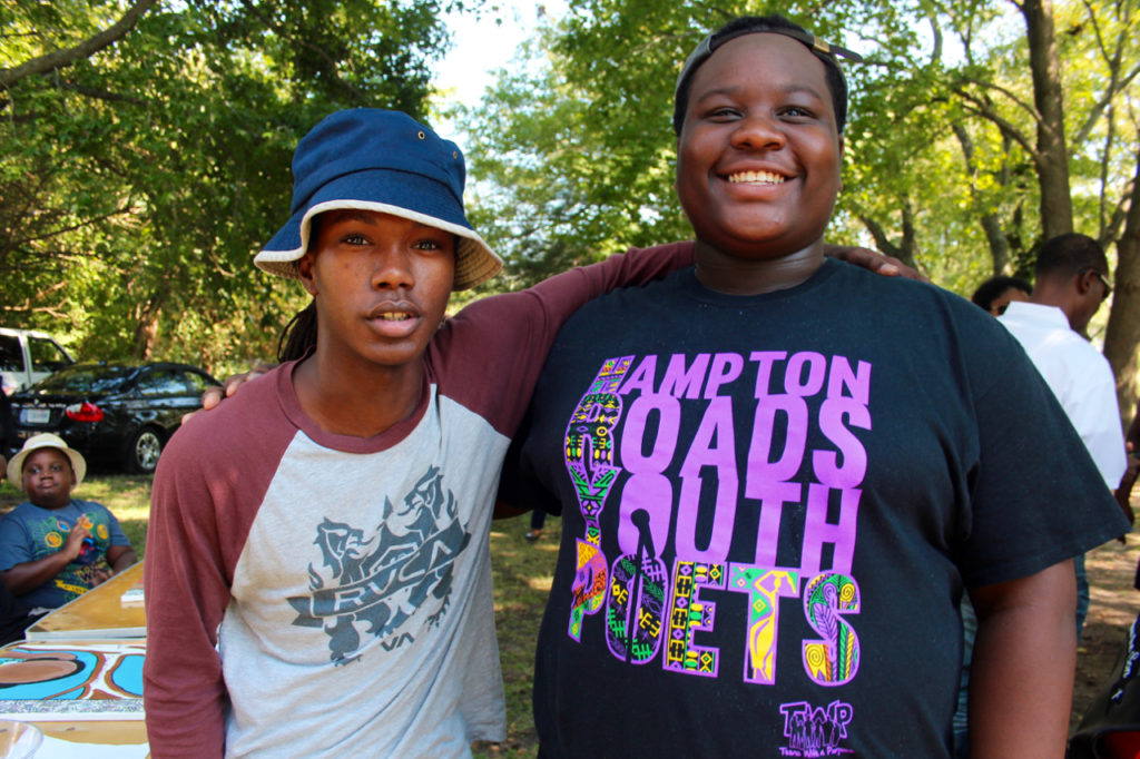 A 19-year-old artist who goes by El and 17-year-old Malik Jordan were among the young people to participate in the ceremony. El helped create a painting of multiple canvases that show past and present. Jordan is a member of the Hampton Roads Youth Poets. [John-Henry Doucette/The Princess Anne Independent News]