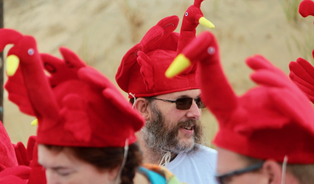 Rich Cassetta of Ashville, N.C., was among 17 loved ones, aged four to 77, to take part in the race while wearing turkey hats. All were visiting Sandbridge, and members of the family were from California, New Jersey and North Carolina. [John-Henry Doucette/The Princess Anne Independent News]
