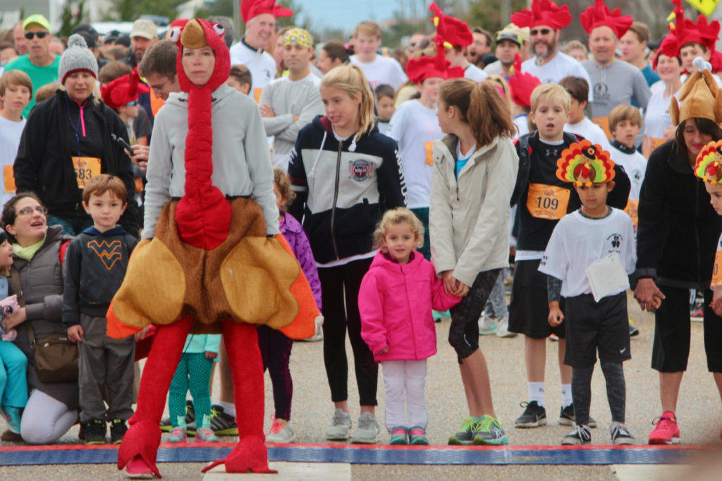 Runners at the starting line during Charlie Normile’s Turkey Trot Race for the Fallen on Thursday, Nov. 24, in Sandbridge. [John-Henry Doucette/The Princess Anne Independent News]
