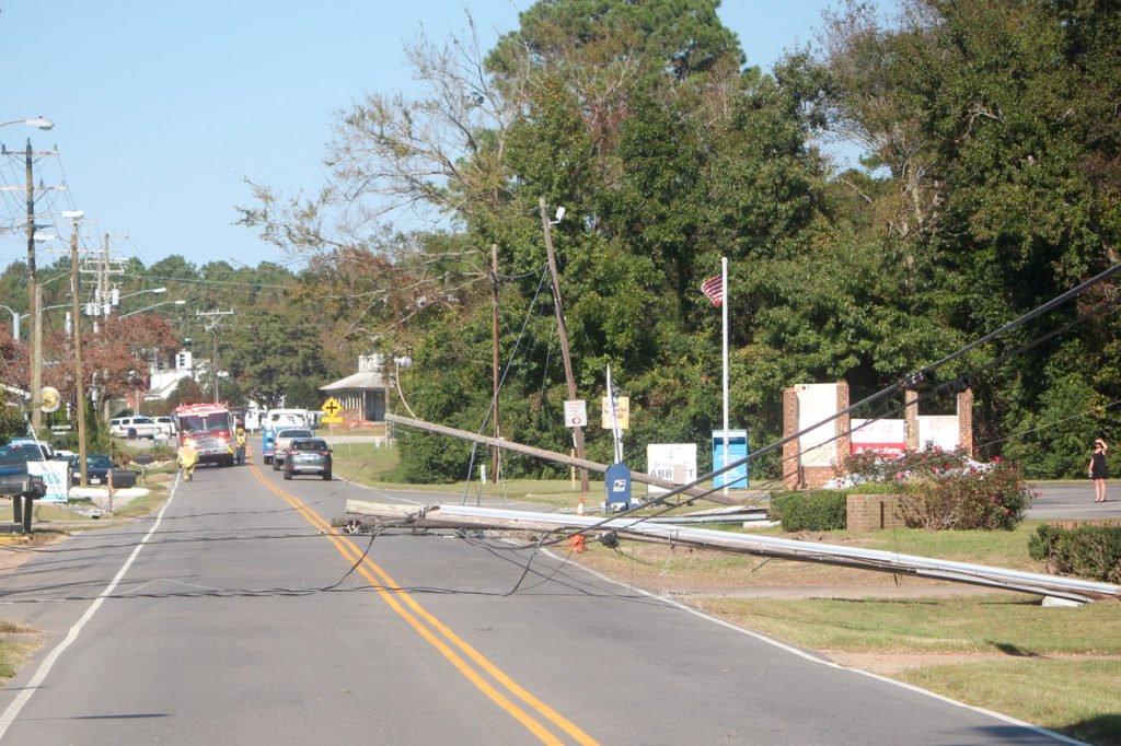 A combine traveling along the 1700 block of Princess Anne Road snagged low-lying power lines on Wednesday, Oct. 19. The operator of the combine was not at fault, according to police, who said the cause was likely lines that were low due to replacement during a recent storm. [John-Henry Doucette/The Princess Anne Independent News]