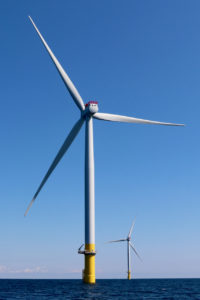 Two test turbines for the Dominion Coastal Virginia Offshore Wind project are seen 27 miles off the Virginia Beach coast on Wednesday, June 16. [John-Henry Doucette/The Princess Anne Independent News]